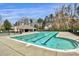 The neighborhood pool provides residents a recreational space with lap lanes, a clubhouse, and mature trees at 18710 Coverdale Ct, Cornelius, NC 28031
