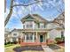 Charming two-story home with a welcoming front porch and beautiful architectural details at 18710 Coverdale Ct, Cornelius, NC 28031