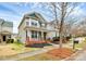 Attractive two-story home featuring a lovely front porch, landscaped yard, and inviting curb appeal at 18710 Coverdale Ct, Cornelius, NC 28031