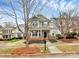 Beautiful two-story home featuring a covered porch and landscaped yard at 18710 Coverdale Ct, Cornelius, NC 28031