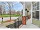 View of front porch with brick accents and hanging flower baskets at 18710 Coverdale Ct, Cornelius, NC 28031