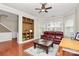 Cozy living room with built-in shelving and a view of the landscaped yard at 18710 Coverdale Ct, Cornelius, NC 28031