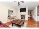Comfortable living room features a fireplace, recessed lighting, and hardwood floors at 18710 Coverdale Ct, Cornelius, NC 28031