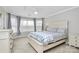 Bedroom with bay window, carpet, ceiling fan, and neutral walls at 18710 Coverdale Ct, Cornelius, NC 28031