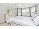 Bedroom with bay windows, carpet, ceiling fan, and neutral walls at 18710 Coverdale Ct, Cornelius, NC 28031