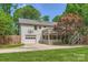 Backyard with a deck, garage access, and green space at 2144 Shadyview Dr, Charlotte, NC 28210