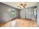 This bedroom features hardwood floors, built-in closet space, and a large window at 2144 Shadyview Dr, Charlotte, NC 28210