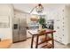 Bright kitchen features stainless steel appliances, white cabinetry, an island, and tile flooring at 2144 Shadyview Dr, Charlotte, NC 28210