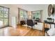 Bright living room with hardwood floors, neutral furniture, and ample natural light from the windows at 2144 Shadyview Dr, Charlotte, NC 28210