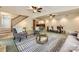 Open-concept living area with elegant decor, a dining space, and stairs leading to the upper level at 2144 Shadyview Dr, Charlotte, NC 28210