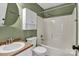 Well-lit bathroom with a shower-tub combo, matching sink and toilet, and a wall cabinet for extra storage at 2318 Kestrel Dr, Rock Hill, SC 29732