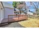 Exterior view of the wood deck with access to the sunroom and backyard at 244 N Race St, Statesville, NC 28677