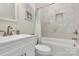 Bathroom with white cabinets, a marble tiled shower and tub combo at 244 N Race St, Statesville, NC 28677