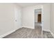 This bedroom features gray vinyl floors, white walls, and white trim at 244 N Race St, Statesville, NC 28677