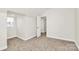 Bedroom with neutral walls, carpet, and natural light at 244 N Race St, Statesville, NC 28677