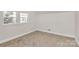 Bedroom with neutral walls, carpet, and natural light at 244 N Race St, Statesville, NC 28677