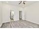 Bright bedroom with neutral walls, wood-look floors, and access to an en-suite bathroom at 244 N Race St, Statesville, NC 28677