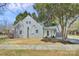 Well-maintained home with a spacious yard, mature trees, and welcoming front entrance at 244 N Race St, Statesville, NC 28677