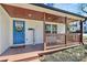 Cozy front porch with a blue door and outdoor seating, perfect for relaxing at 244 N Race St, Statesville, NC 28677