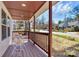 Inviting front porch with a cozy seating area, perfect for enjoying the neighborhood view at 244 N Race St, Statesville, NC 28677