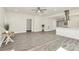 Open concept living area featuring modern flooring, neutral paint, and stainless range hood at 244 N Race St, Statesville, NC 28677