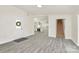 View of an open living room with stairs and an entry to the kitchen area at 244 N Race St, Statesville, NC 28677