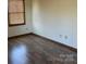 Bedroom with a wooden floor and a window at 2601 Bobwhite Cir, Wingate, NC 28174