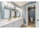 Bathroom showcasing a double vanity, neutral tile floors, and a separate toilet room at 2953 Craftsman Ln, Charlotte, NC 28204