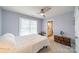 Comfortable bedroom with a ceiling fan, lots of natural light, and ensuite bathroom at 2953 Craftsman Ln, Charlotte, NC 28204