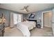 Tranquil bedroom with soft blue walls, plush carpeting, and ample natural light from large windows at 2953 Craftsman Ln, Charlotte, NC 28204