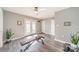 The bonus room is complete with laminate flooring, light neutral paint, a ceiling fan and door leading to the outside at 2953 Craftsman Ln, Charlotte, NC 28204