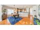 Spacious dining area with hardwood floors, modern lighting, open to the kitchen with stainless steel appliances at 2953 Craftsman Ln, Charlotte, NC 28204