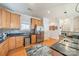 Well-lit kitchen features wood cabinets, stainless steel appliances, granite countertops, and tile backsplash at 2953 Craftsman Ln, Charlotte, NC 28204