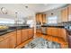 Bright kitchen with stainless steel appliances, granite countertops, mosaic backsplash, and hardwood floors at 2953 Craftsman Ln, Charlotte, NC 28204
