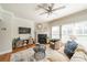 Bright living room with hardwood floors, fireplace, and large windows allowing for plenty of natural light at 2953 Craftsman Ln, Charlotte, NC 28204