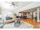 Hardwood flooring, neutral paint and a large opening into the dining room are features of this large living space at 2953 Craftsman Ln, Charlotte, NC 28204