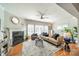 Bright living room with hardwood floors, a fireplace, and large windows offering lots of natural light at 2953 Craftsman Ln, Charlotte, NC 28204