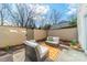 Outdoor patio area featuring seating, plants, and privacy fence at 2953 Craftsman Ln, Charlotte, NC 28204