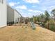 Large backyard features a playset and fence, perfect for outdoor fun at 3008 Quinebaug Rd, Fort Mill, SC 29715