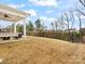 Backyard patio features an outdoor kitchen, seating, and string lights for relaxing at 3008 Quinebaug Rd, Fort Mill, SC 29715
