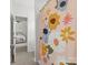 Bathroom doorway view, featuring a vibrant floral shower curtain and glimpses of bedroom at 3008 Quinebaug Rd, Fort Mill, SC 29715