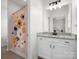 Bathroom featuring a vanity with stone countertop, floral shower curtain and tile flooring at 3008 Quinebaug Rd, Fort Mill, SC 29715