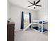 bedroom with bunk beds, slide, and window with blue curtains at 3008 Quinebaug Rd, Fort Mill, SC 29715
