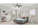 Bright bedroom with three windows, neutral decor, and a ceiling fan for comfort at 3008 Quinebaug Rd, Fort Mill, SC 29715