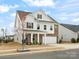 Charming two-story home with brick accents, a well-manicured lawn, and a two-car garage at 3008 Quinebaug Rd, Fort Mill, SC 29715