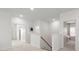 Upstairs hallway featuring a neutral color scheme with carpet and a view of the stairwell at 3008 Quinebaug Rd, Fort Mill, SC 29715