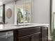 Close-up shot highlighting the kitchen island's sink and faucet, complemented by quartz countertops and modern cabinetry at 3008 Quinebaug Rd, Fort Mill, SC 29715