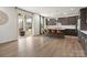 Open concept kitchen with a central island, stainless steel appliances, and access to the backyard patio at 3008 Quinebaug Rd, Fort Mill, SC 29715