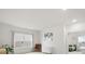 Bright, airy living room with a window, modern decor, and a glimpse into an adjacent bedroom at 3008 Quinebaug Rd, Fort Mill, SC 29715