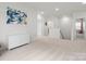 Expansive living area showcasing stairs, white walls, and neutral carpet throughout at 3008 Quinebaug Rd, Fort Mill, SC 29715